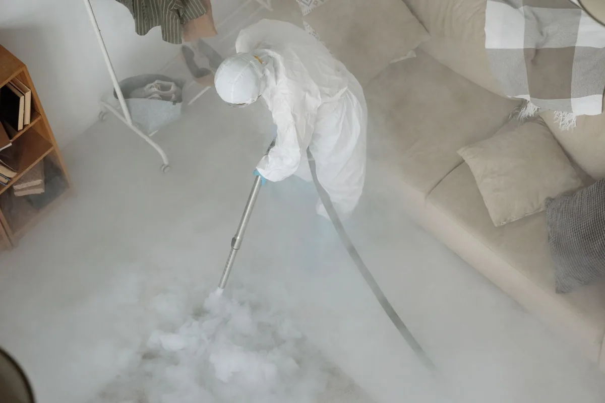 Biohazard cleanup technician in protective equipment, Pacific Park, Santa Ana, CA